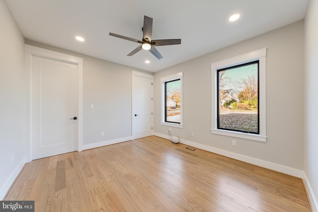 unfurnished bedroom featuring ceiling fan and light hardwood / wood-style floors