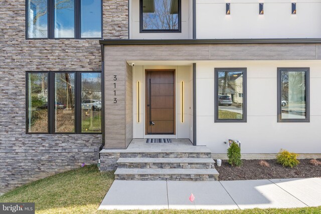 3113 Circle Hill Rd, Alexandria, VA 22305 - view of exterior entry featuring stone siding and stucco siding