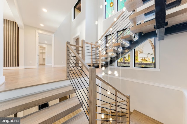 stairs with wood-type flooring