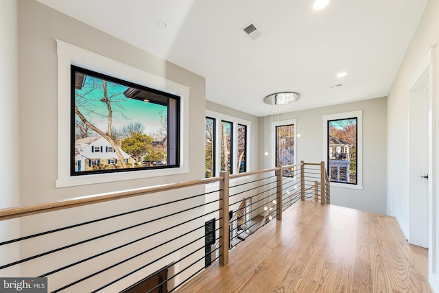 hall with light hardwood / wood-style flooring