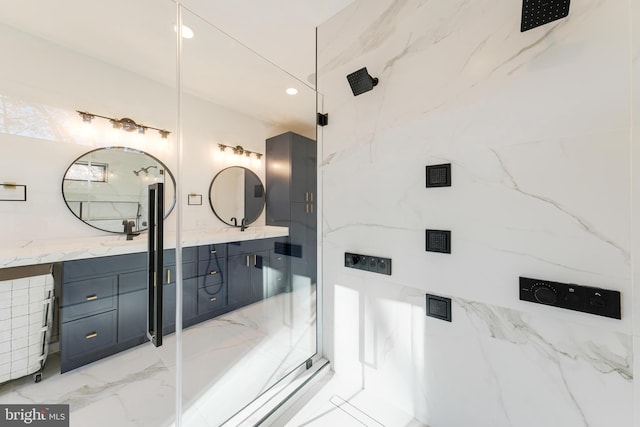 bathroom with vanity, walk in shower, and tile walls