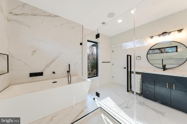 bathroom featuring vanity and shower with separate bathtub