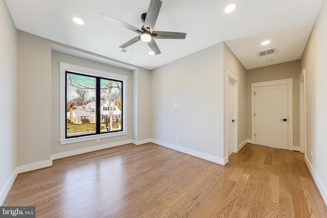 unfurnished room with light wood-type flooring and ceiling fan