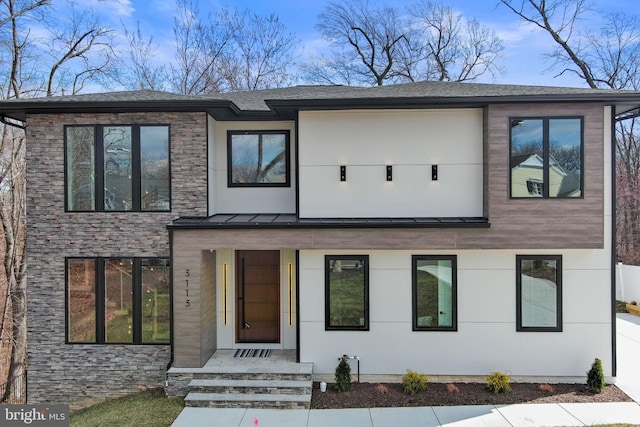 3113 Circle Hill Rd, Alexandria, VA 22305 - view of front facade with stone siding and a standing seam roof