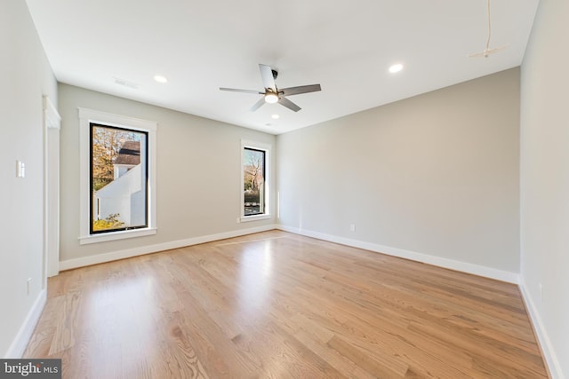 unfurnished room featuring light hardwood / wood-style floors and ceiling fan