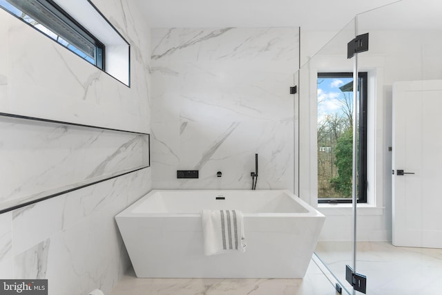 3113 Circle Hill Rd, Alexandria, VA 22305 - bathroom featuring healthy amount of natural light, a freestanding tub, and marble tiled flooring