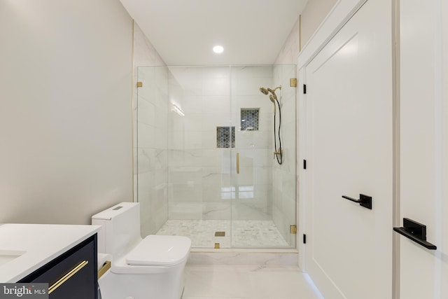 bathroom featuring toilet, vanity, and walk in shower