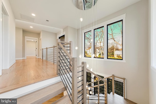 stairway featuring hardwood / wood-style floors