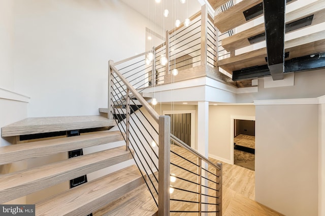 stairway with a towering ceiling