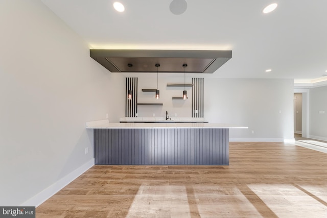 3113 Circle Hill Rd, Alexandria, VA 22305 - kitchen featuring kitchen peninsula, a kitchen bar, light hardwood / wood-style flooring, and sink