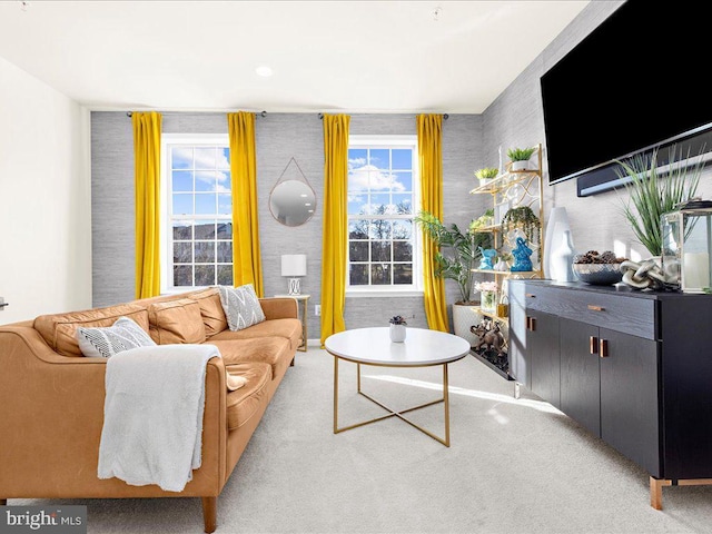 living room featuring a wealth of natural light and light carpet