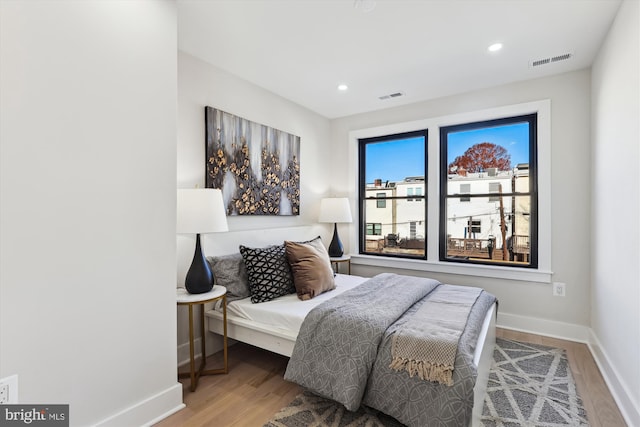 bedroom featuring wood-type flooring