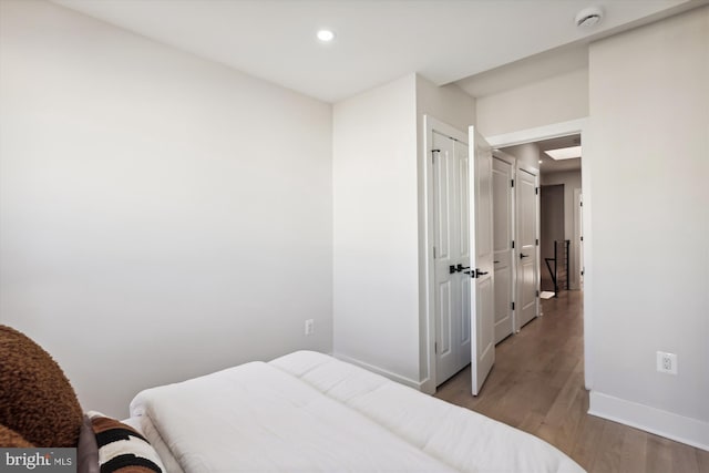 bedroom featuring a closet and hardwood / wood-style flooring