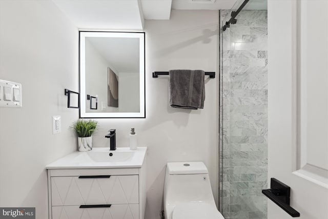 bathroom with vanity, toilet, and walk in shower