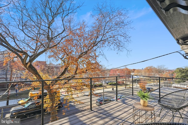 wooden terrace featuring a mountain view