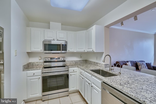 kitchen with white cabinetry, sink, appliances with stainless steel finishes, and ornamental molding