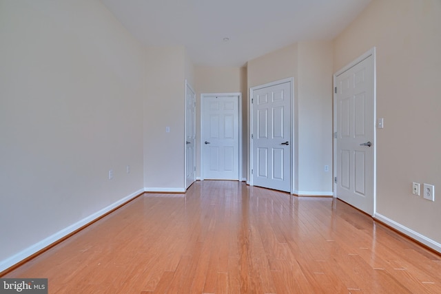 unfurnished room featuring light hardwood / wood-style flooring