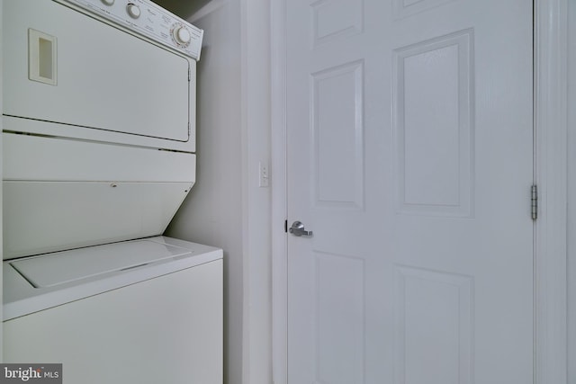 laundry area featuring stacked washer and dryer