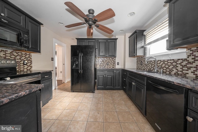 kitchen featuring sink, backsplash, dark stone countertops, and black appliances