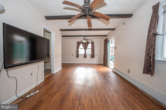 unfurnished living room with beamed ceiling, wood-type flooring, a textured ceiling, and a baseboard radiator