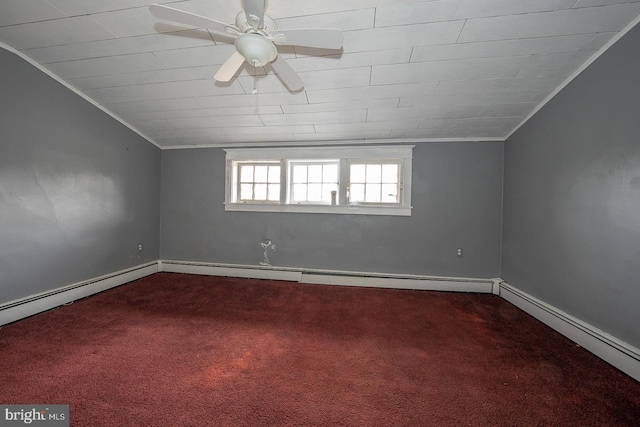 carpeted spare room with lofted ceiling, a baseboard radiator, ceiling fan, and ornamental molding