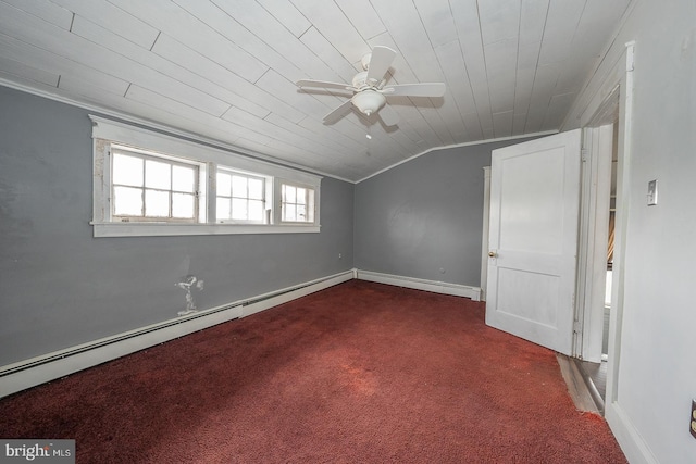 carpeted spare room featuring baseboard heating, vaulted ceiling, ceiling fan, and ornamental molding