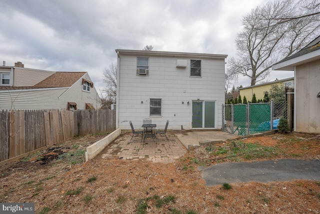 rear view of property featuring a patio area