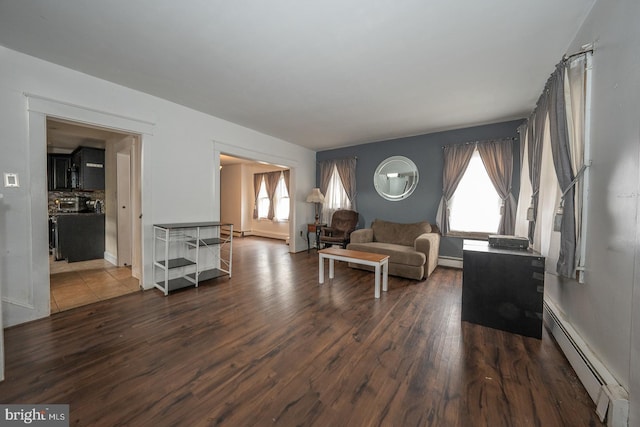 living room featuring a baseboard radiator and dark hardwood / wood-style floors