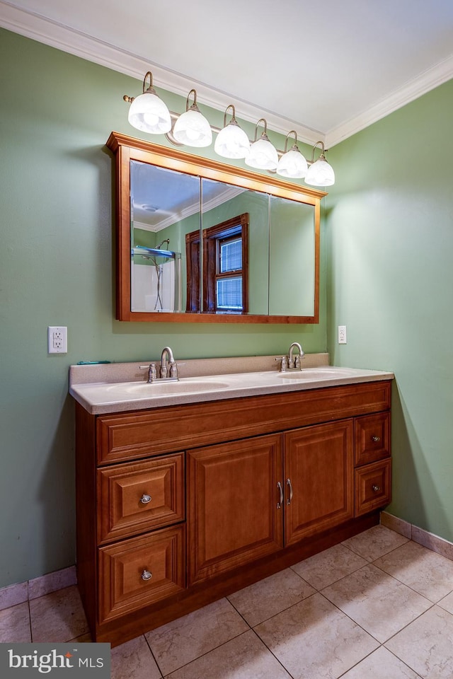 bathroom featuring tile patterned floors, vanity, and ornamental molding