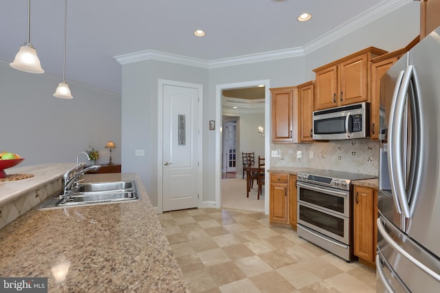 kitchen with sink, hanging light fixtures, backsplash, appliances with stainless steel finishes, and ornamental molding