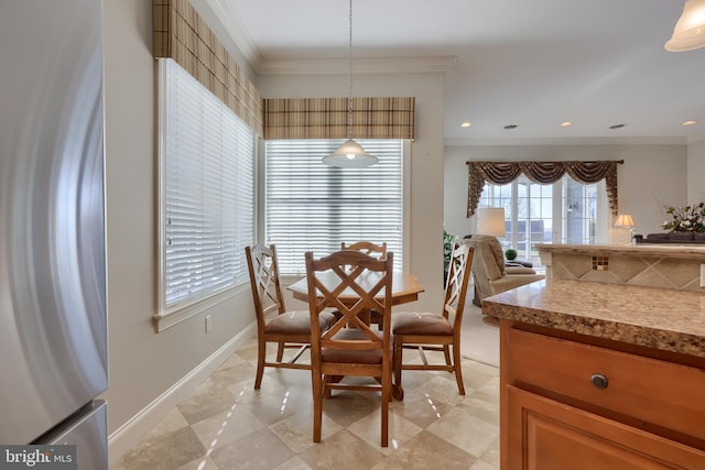 dining room with crown molding