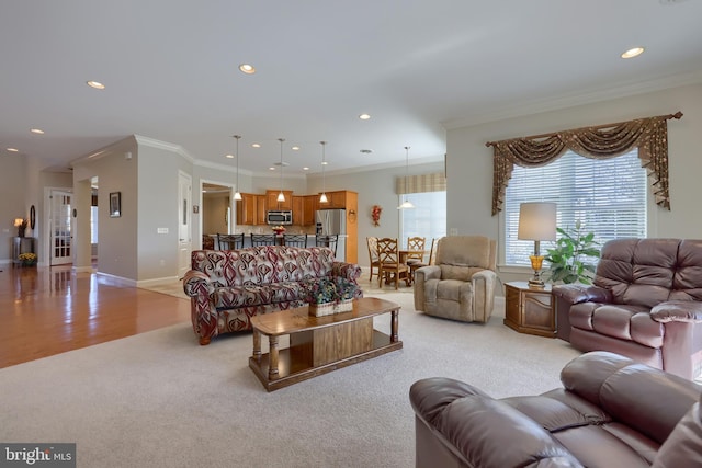 living room featuring light wood-type flooring and crown molding