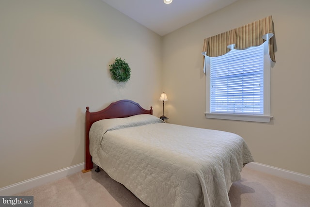 bedroom with light carpet