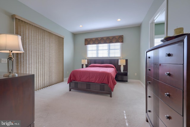 bedroom featuring light colored carpet