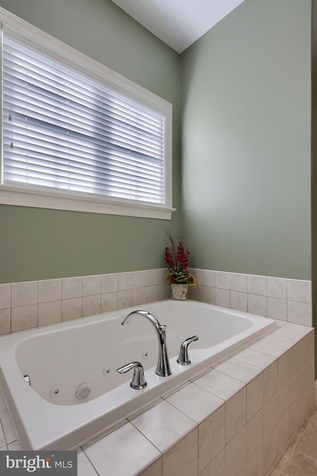 bathroom with tiled bath