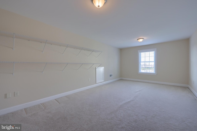 unfurnished room with carpet flooring