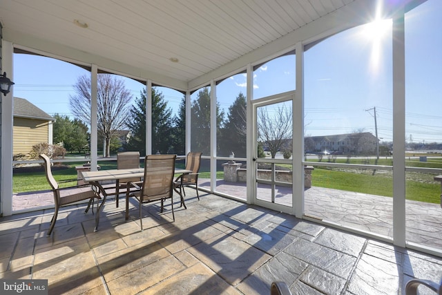 sunroom / solarium featuring wooden ceiling