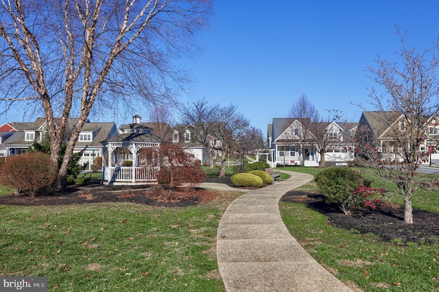 view of community with a gazebo and a yard