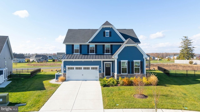 view of front of house with a garage and a front lawn