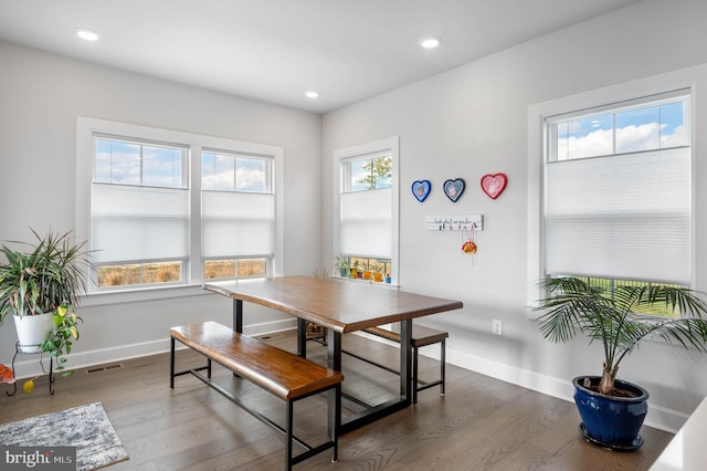 dining area with dark wood-type flooring