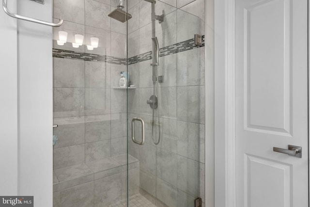 bathroom featuring a shower with door