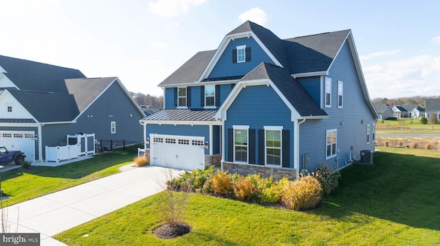 view of front facade featuring a front lawn, central AC unit, and a garage