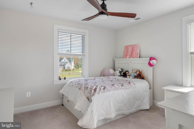 bedroom featuring ceiling fan and light colored carpet