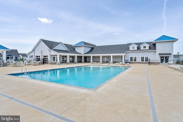 view of swimming pool featuring a patio