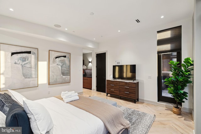 bedroom featuring light parquet flooring