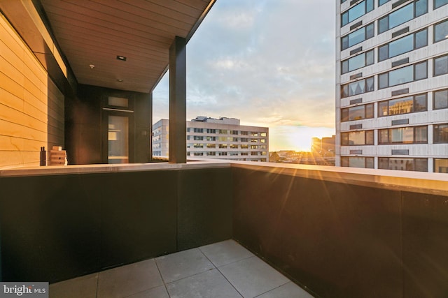 view of balcony at dusk