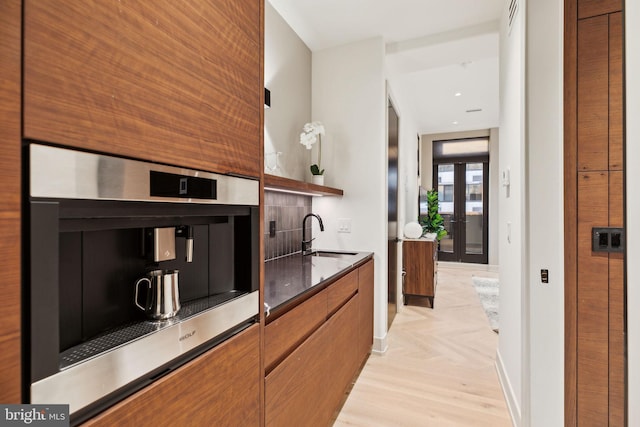 kitchen featuring sink and stainless steel oven