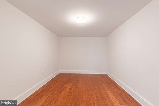 empty room with hardwood / wood-style floors