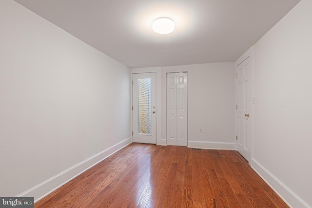 entrance foyer featuring hardwood / wood-style floors