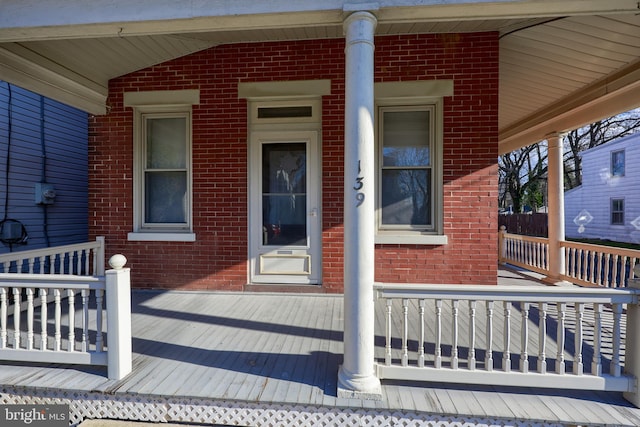 wooden terrace with a porch